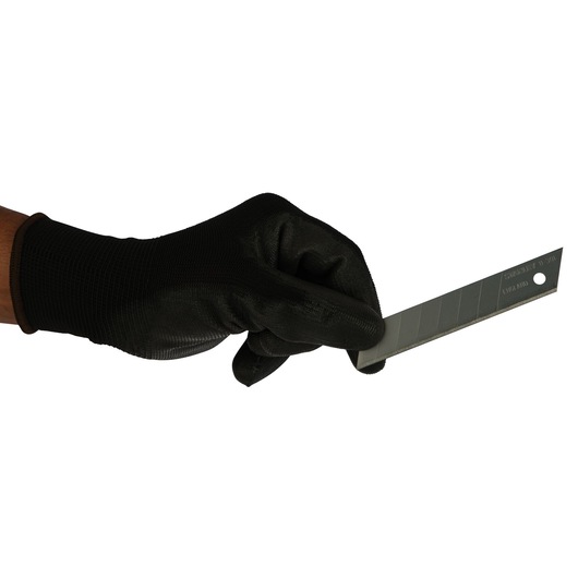 Stanley 0-11-301 utility blade held by gloved hand, side angle, photography product image.