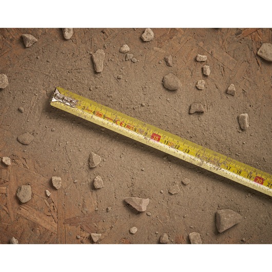 STANLEY 0-33-522 tape measure photography on dusty surface with scattered rocks