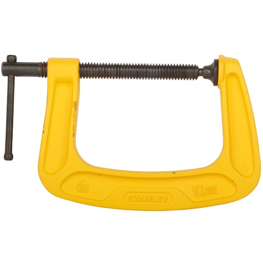 Yellow Stanley 4-inch C-clamp, used for holding materials securely in place during photography or construction.