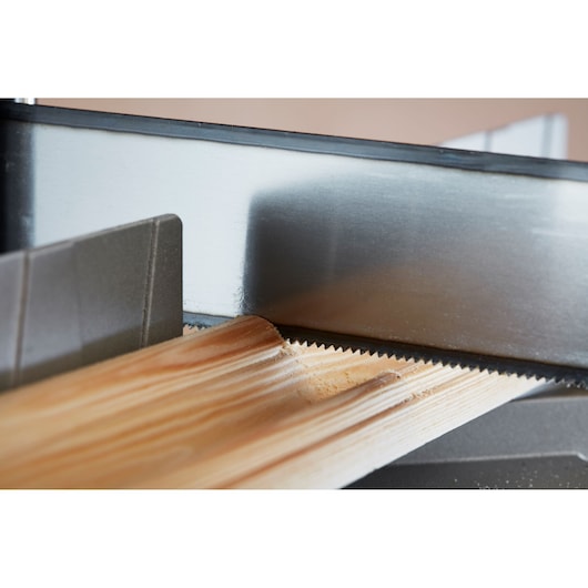 STANLEY 1-20-800 photography of fine-toothed saw cutting wooden molding, close-up angle, woodworking detail.