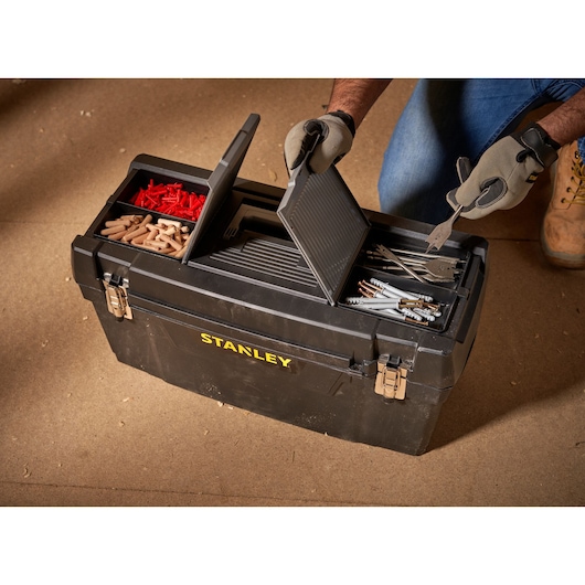 STANLEY 1-94-859 toolbox with compartments open, showing assorted fasteners and hand tools, top view.