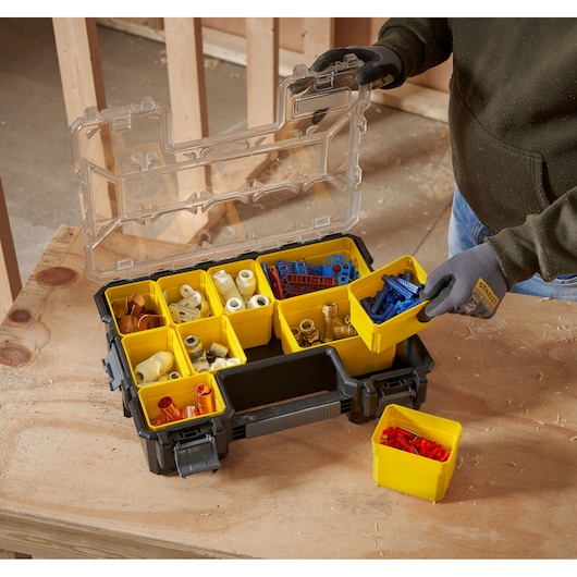 STANLEY 1-97-521 organiser with yellow compartments, assorted hardware, photo from above on workbench.