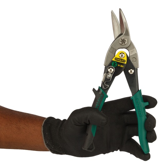 STANLEY 2-14-564 aviation snips with green handles held by a gloved hand, side view.