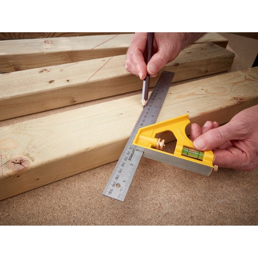 Photo of STANLEY 2-46-028 combination square used to mark lines on wooden boards.