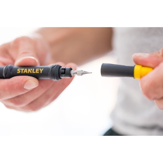 Photo of STANLEY 66-344M precision screwdriver close-up with interchangeable tip held in hand.