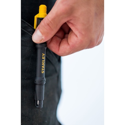 Stanley 66-344M screwdriver pen held by hand near black pocket, yellow and black design.