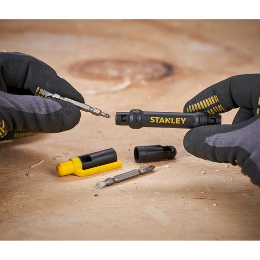 Photo of STANLEY 66-344M multi-bit screwdriver set with bits and holders shown on a wooden surface.
