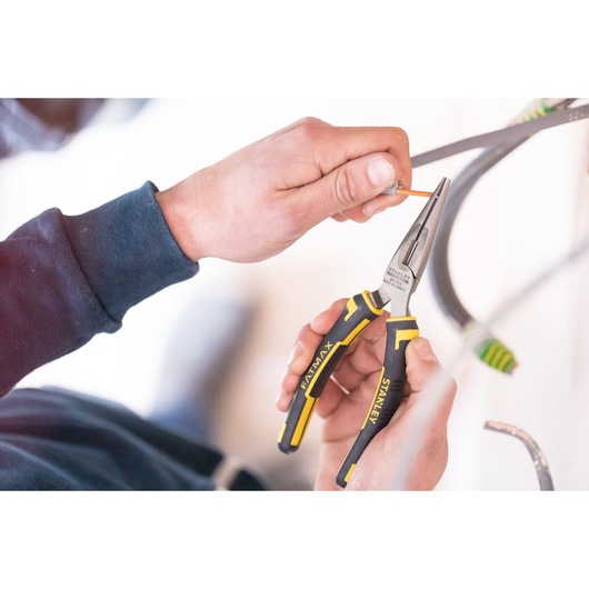 Photo of STANLEY 89-869 long nose pliers with black and yellow handles in use, gripping wire.