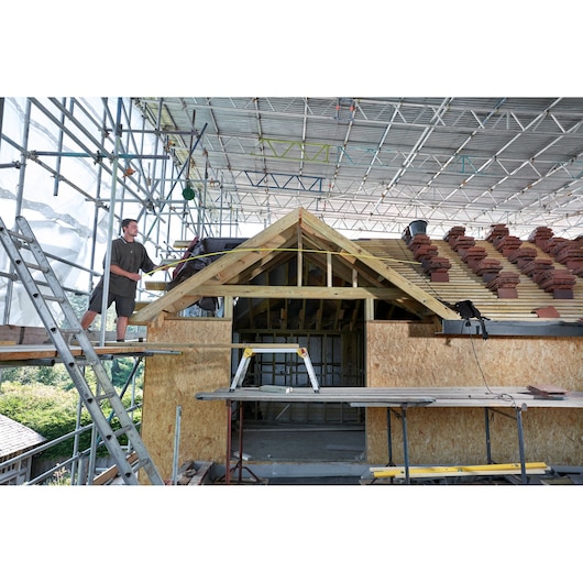 STANLEY FMHT0-36337 photography of construction site showing roof work and scaffolding.