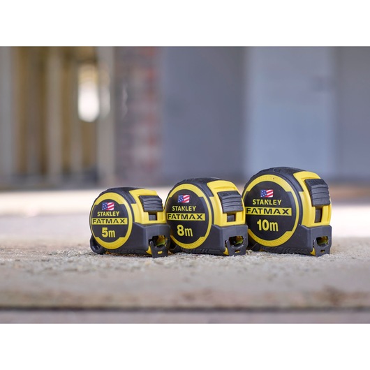 STANLEY FMHT0-36337 tape measures in 5m, 8m, and 10m sizes, yellow and black, shown side by side.