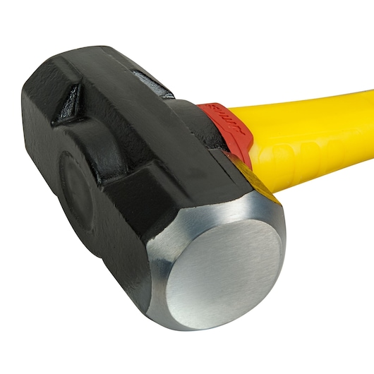 STANLEY FMHT1-56019 sledgehammer with black steel head and yellow handle, close-up on white background.