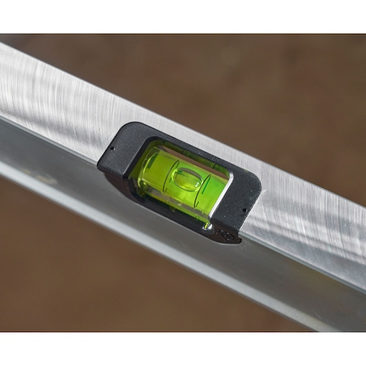 STANLEY FMHT43670-1 spirit level close-up showing green bubble vial, silver body, product photography.
