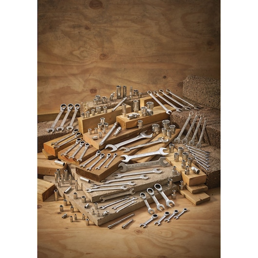 STANLEY FMMT13034-0 hand tools set with assorted wrenches and sockets photographed on a wooden display.