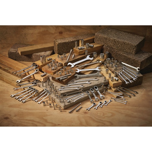 STANLEY FMMT13039-0 assorted wrenches and sockets kit displayed on wooden blocks, product photography.
