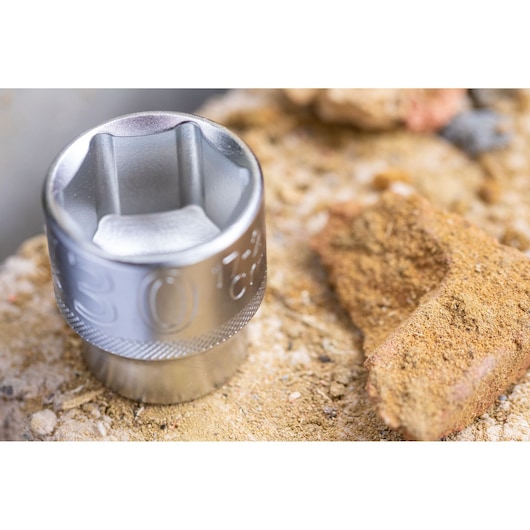 STANLEY FMMT82679-0 socket tool, metallic finish, close-up on rough stone surface.