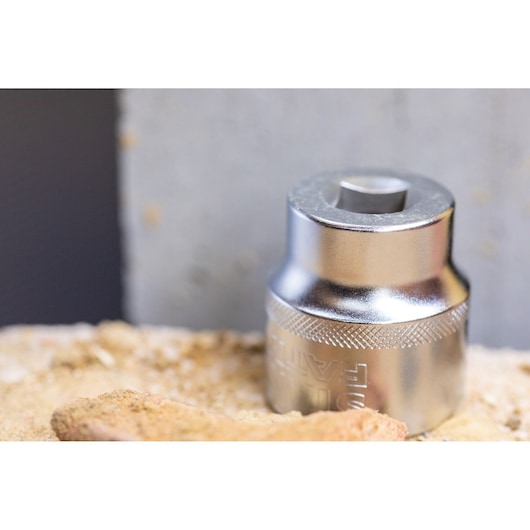 STANLEY FMMT82684-1 chrome socket, close-up photography on rough surface.