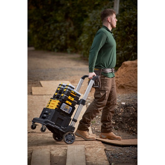STANLEY FMMT98104-0 stackable tool boxes on wheeled cart outdoors, side angle.