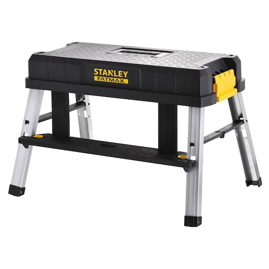 STANLEY FMST81083-1 work platform with aluminum legs, black top, yellow latch, photographed on white background.