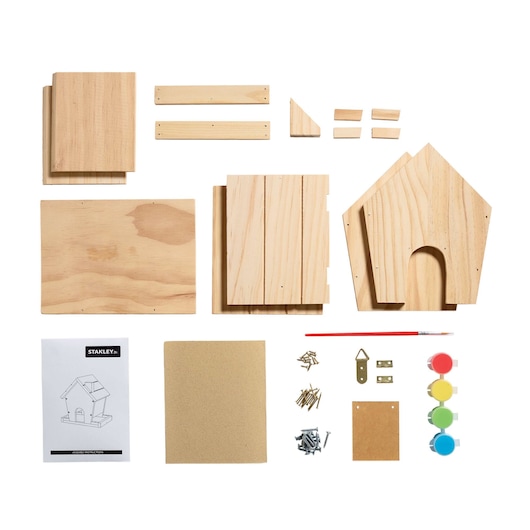 Stanley birdhouse kit components shown from top view on white, includes wood pieces, paint, brush, nails and instructions.