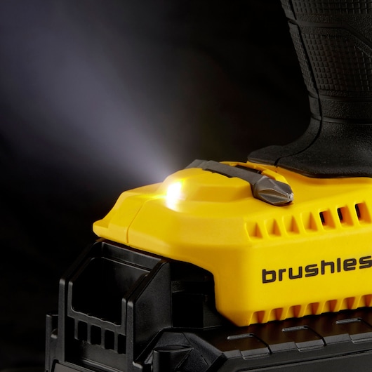 STANLEY KFMCD628D1K drill close-up showing yellow brushless body, integrated LED work light, side angle.