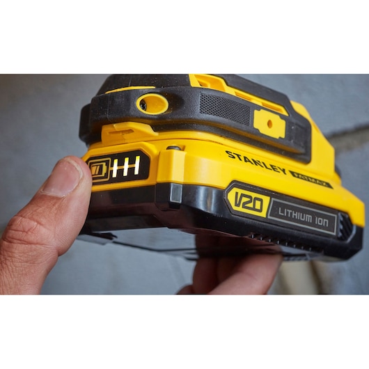 Stanley V20 SFMCD711D21 lithium ion battery with charge indicator, close-up photo.