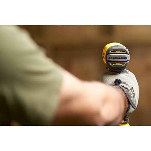 STANLEY SFMCF810M1K brushless cordless impact driver held by a gloved hand during use.
