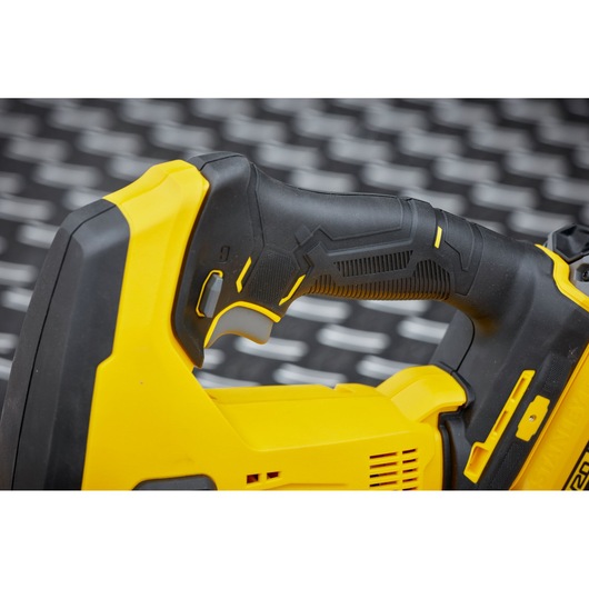 STANLEY SFMCS600M1K close-up of black and yellow power tool handle with textured grip, side angle.