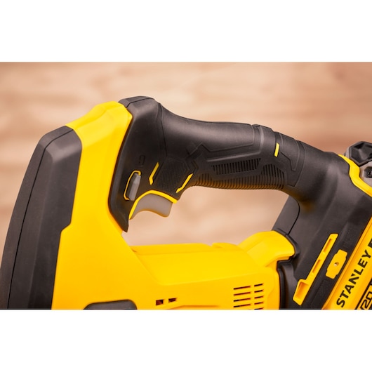 STANLEY SFMCS600M1K photography of yellow and black power tool handle, close-up angle.