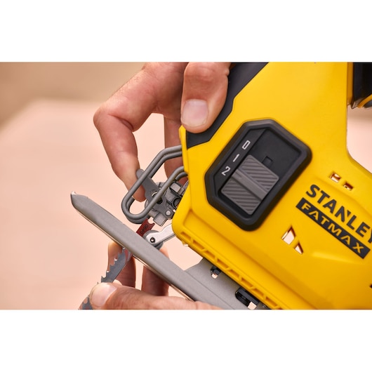Photo of STANLEY SFMCS600M1K jigsaw tool, close-up showing blade installation feature.