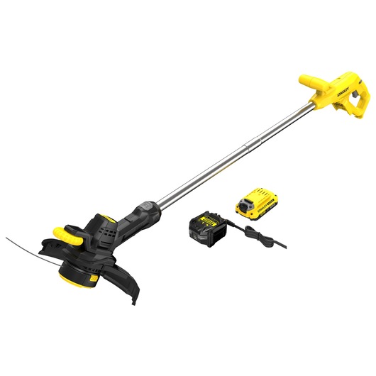 STANLEY SFMCST925M1 string trimmer kit with battery and charger, yellow and black, side angle on white background.