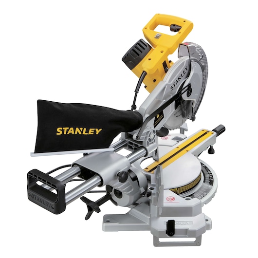 STANLEY SM18-B2C sliding compound miter saw with yellow and black handle, dust bag, and clear blade guard, front angle.