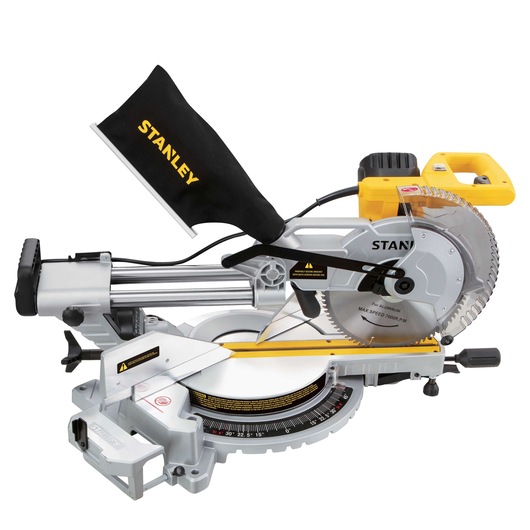 STANLEY SM18-B2C miter saw, silver and yellow, side angle, with blade guard and dust bag, on white background.