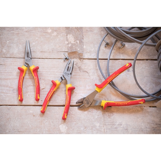 Photo of STANLEY STHT0-73920 pliers set with red and yellow handles on a wooden surface, side angle.