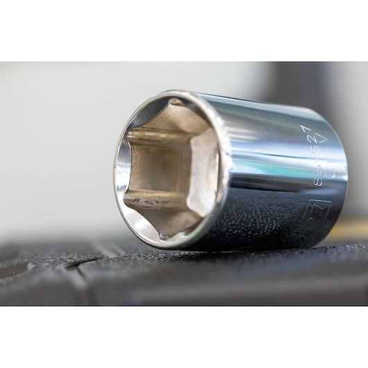 STANLEY STMT82828-1 chrome socket, close-up side angle, photography of metal tool on dark surface.