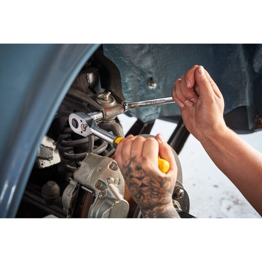 Photo of STANLEY STMT82832-1 ratchet and combination wrench set in use on vehicle suspension.