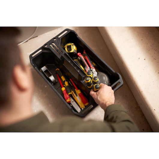 STANLEY STST1-72359 tool tray photo with assorted hand tools and a person reaching for screwdrivers.