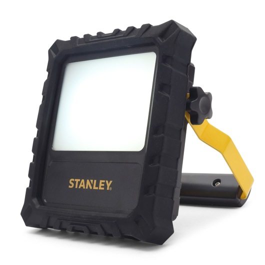 Stanley LED work light with rugged black frame and yellow handle, suitable for photography and workspaces.