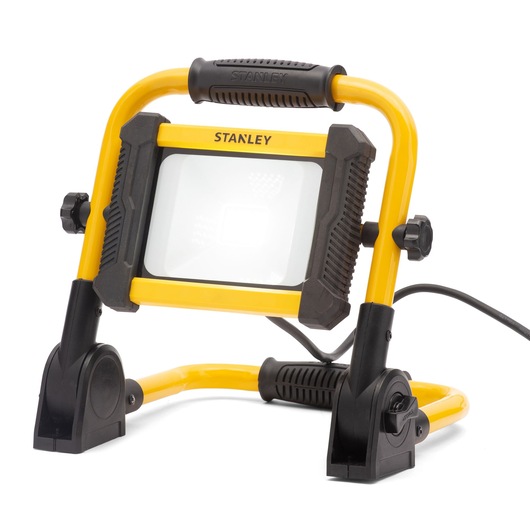 Stanley LED work light with a yellow frame and black accents, shown on an adjustable stand with power cord.