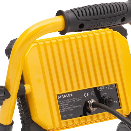 STANLEY SXLS31334E yellow portable LED work light, close-up of back panel with handle and power switch.