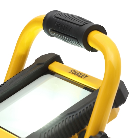 STANLEY SXLS31335E LED work light, yellow and black, close-up angled photo on white background.