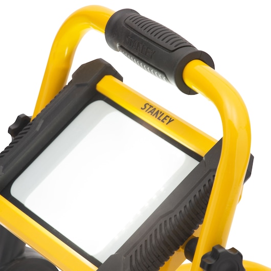 STANLEY SXLS31336E portable LED work light, yellow and black, close-up angled view on white background.