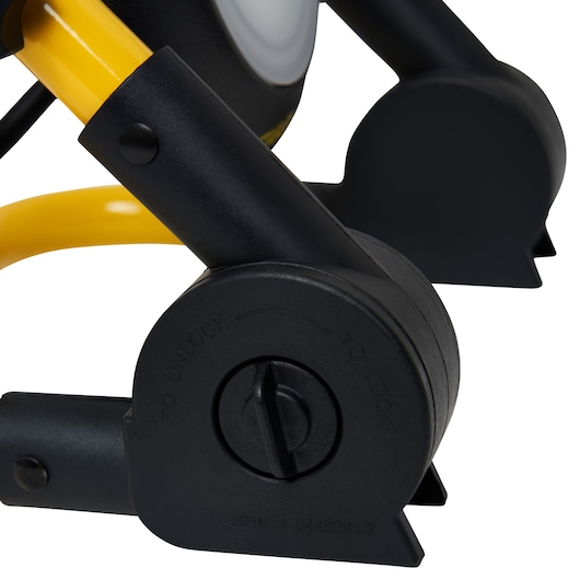 STANLEY SXLS35525E photography close-up of black and yellow adjustable locking mechanism on tool frame, white background.