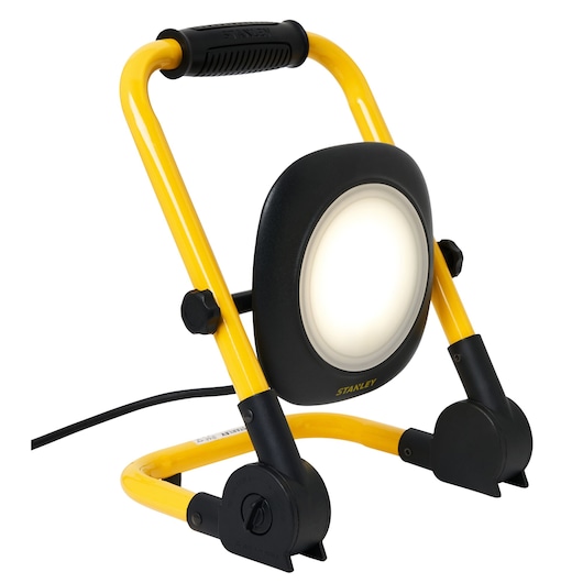 STANLEY SXLS35526E LED work light with yellow frame, black handle, and adjustable stand, front angle photo.