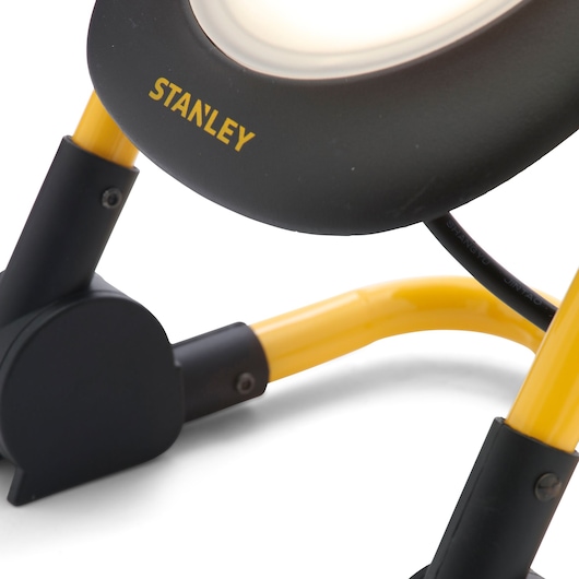 STANLEY SXLS35527E photography of LED work light base with yellow and black metal frame, close-up angle.