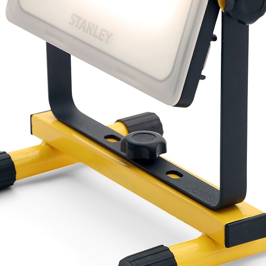 STANLEY SXLS36385E portable LED work light, close-up view on yellow metal stand, photography asset.