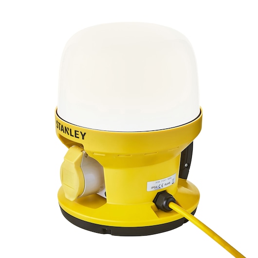 Photo of STANLEY SXLS36986E portable LED work light, yellow base, white dome, power cord, side view.