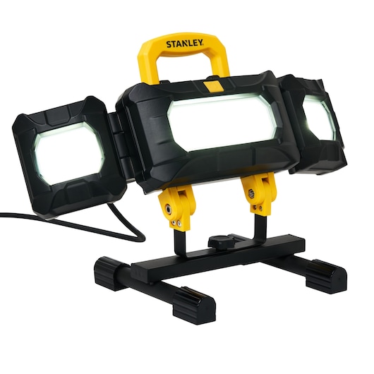 STANLEY SXLS37180E LED work light with adjustable panels, yellow handle, on black stand, front angle.