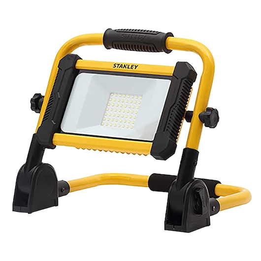 STANLEY SXLS41221E LED work light with yellow frame and black rubber grip, photography, angled front view.