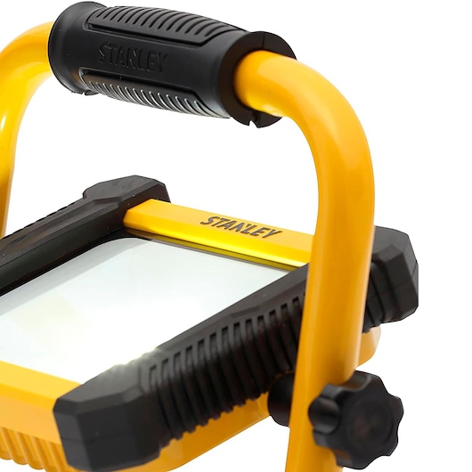 Stanley SXLS41221E LED work light, close-up angled view, yellow frame with black handle and corners.