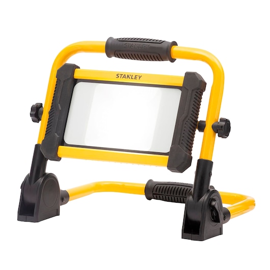STANLEY SXLS41225E portable LED work light with yellow frame, black handle, and adjustable stand, front angle.